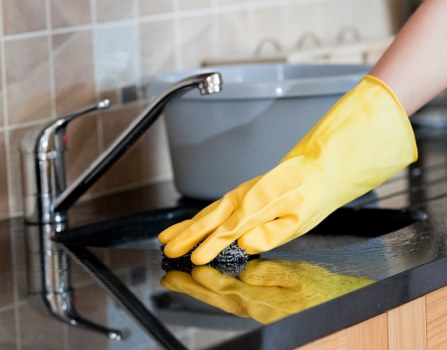 Kitchen surfaces being cleaned after a builders project in Camberwell